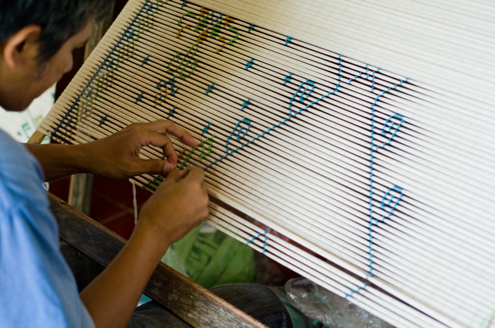 Process of ikat using colour coded plastic cord in Bali